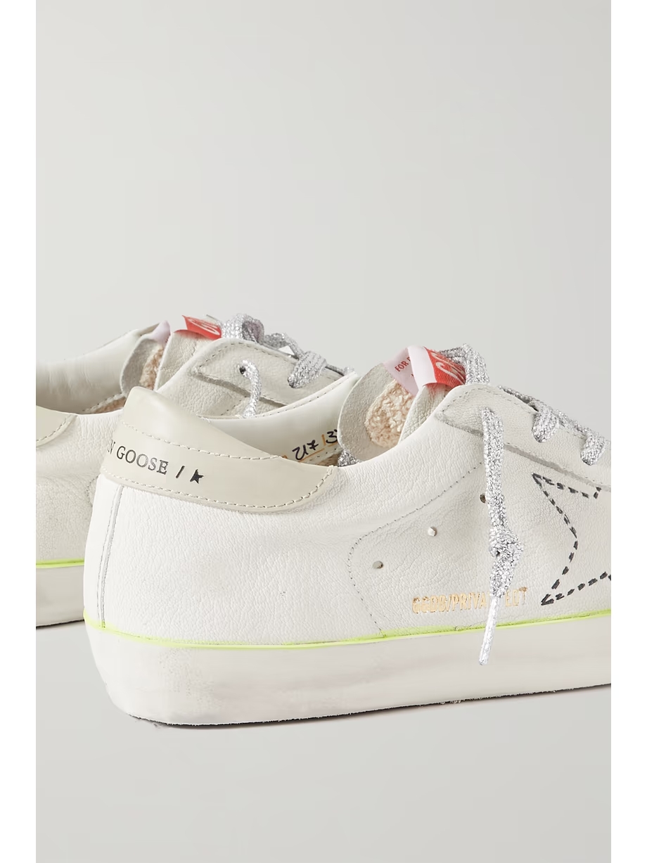 Superstar distressed embroidered textured-leather sneakers