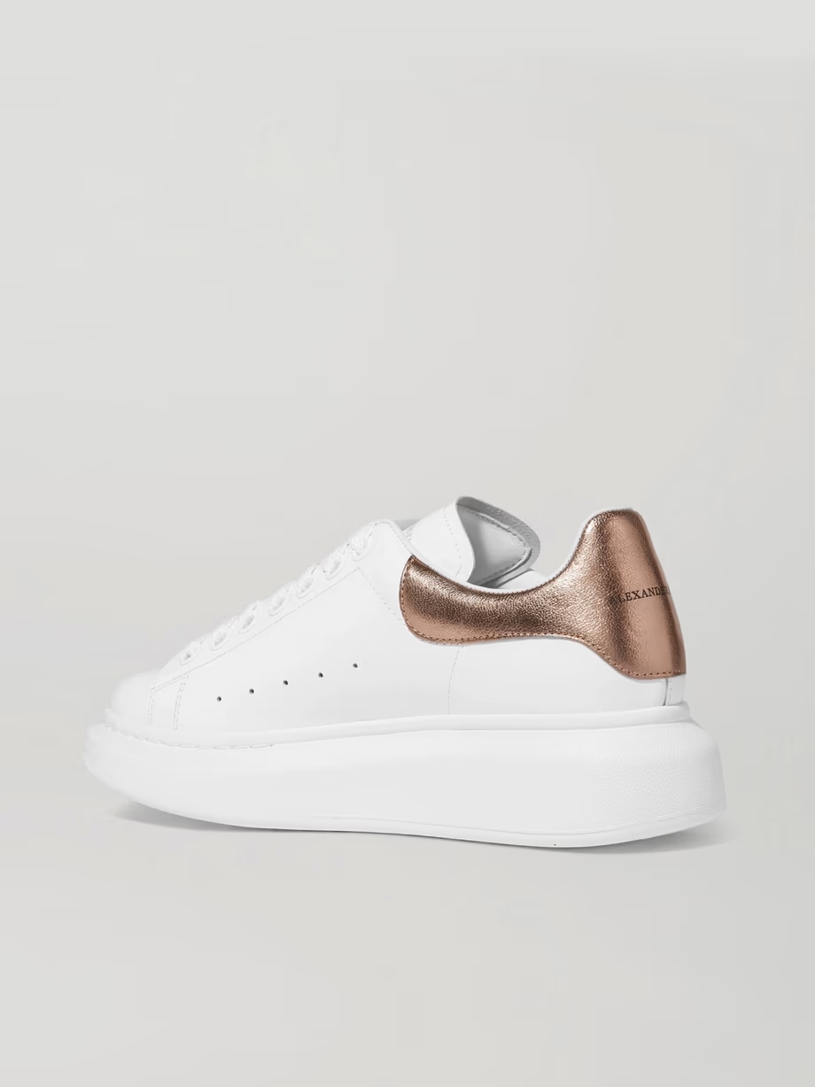 Metallic-trimmed leather exaggerated-sole sneakers